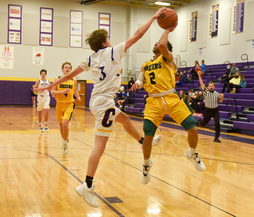Hickman's Benjamin Wilson blocks Rock Bridge's Xavier Sykes